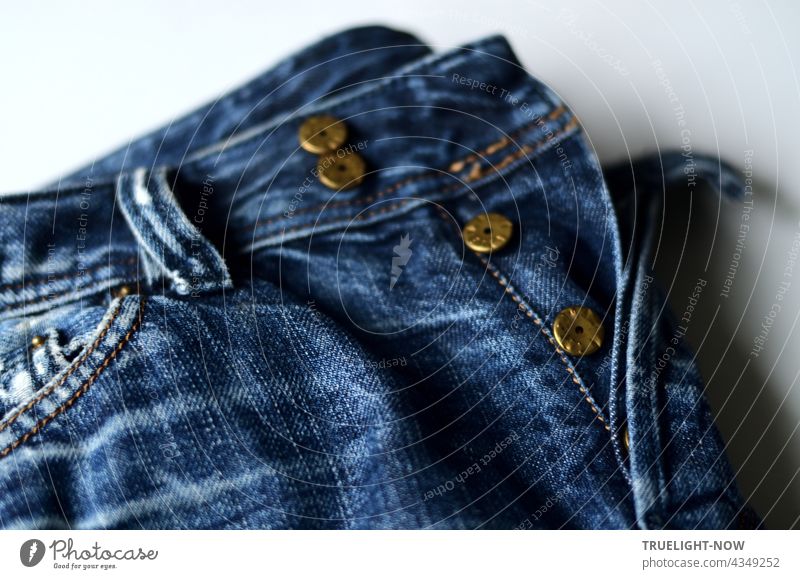 Old jeans trousers - scuffed and faded - metal buttons. Blue Bleached worn Copper colours Pants Jeans Fashion fashion fashion photo textile garments detail