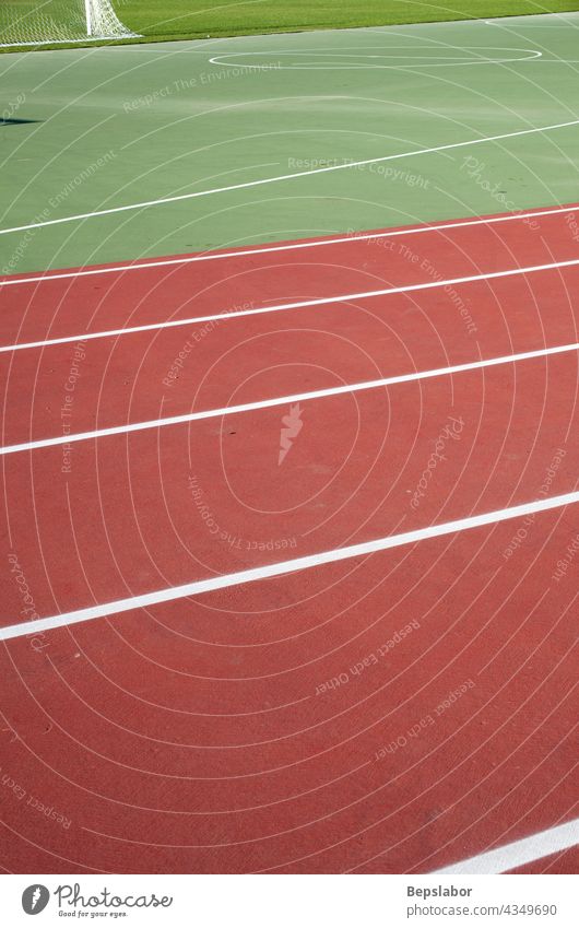 Track and field athletics exercise goals grass green network poles racetrack runway sports stadium synthetic action compete competition competitive event fast