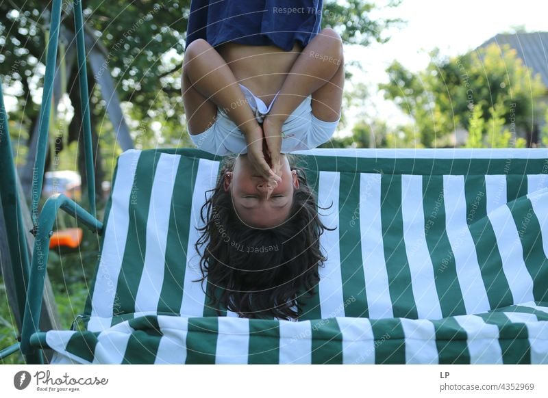 girl hanging head down safe upside down okay Like secure Safety (feeling of) Protection arms Stay Face hoping Opinion cheeky Authentic real life Expression