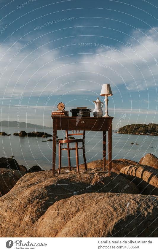 Old desk. Work table with a beautiful landscape. Desk with books, clock, lamp. Digital Nomad. background business chair coffee countryside design display drink