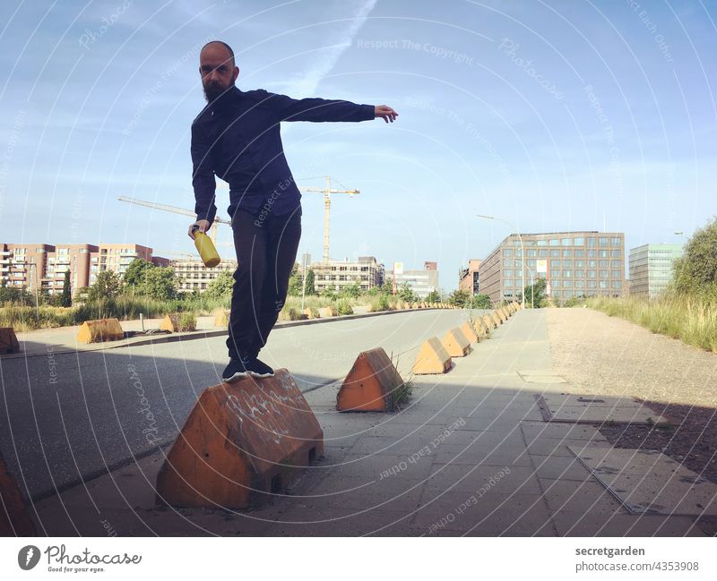 [PARKTOUR HH 2021] In balance with itself and the bollard. Balance disequilibrium Street Colour photo Man masculine reeling Outdoors Sports active activity