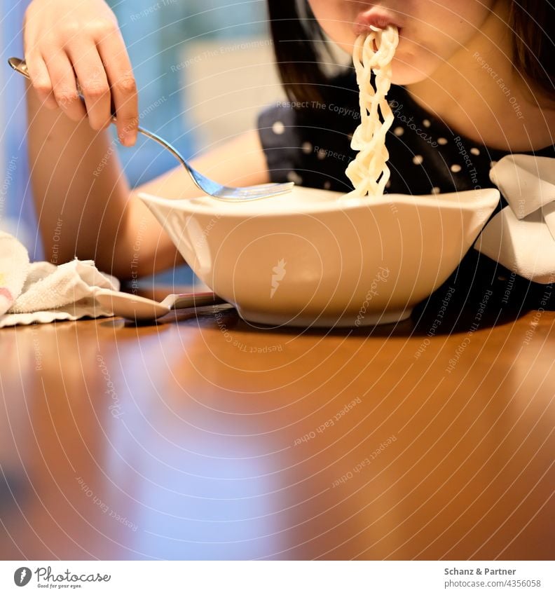 Kid shuffles noodles Eating Noodles Noodle soup Child Nutrition Food Colour photo Lunch Family family life Dinner Table
