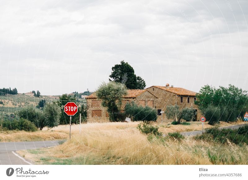 Stop sign on a road in Tuscany Street Road sign Italy Summer Landscape Rural
