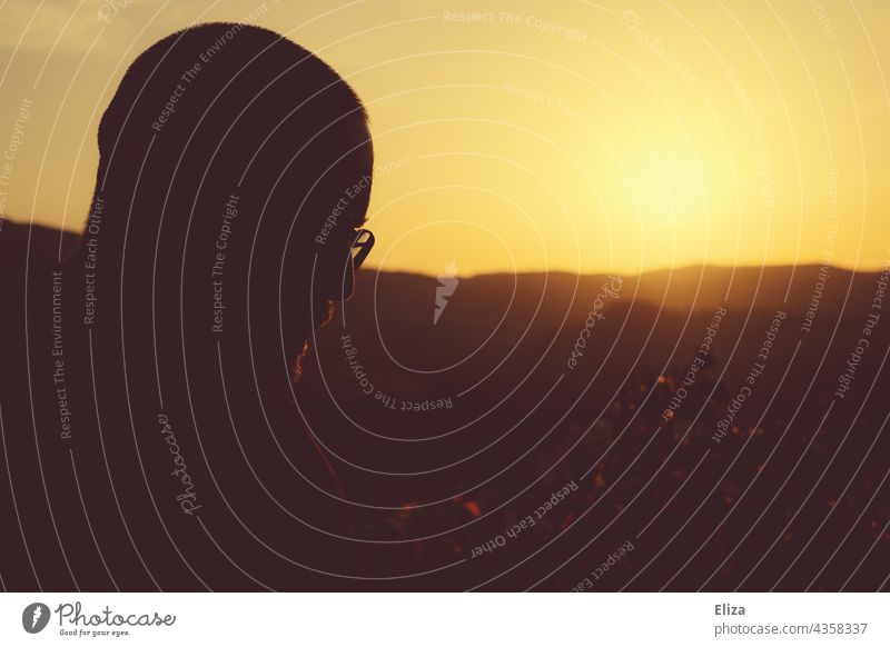 Silhouette of a man face at sunset Sunset Man Face Profile Back-light Shadow Head Meditative Human being Light Contrast warm Landscape