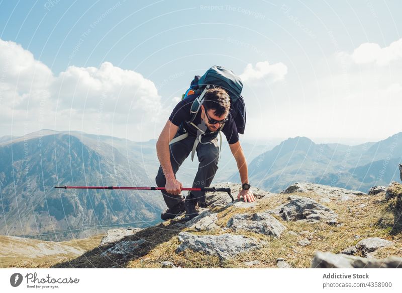 Male hiker with trekking pole in mountains man traveler highland summer sunny male wales united kingdom uk great britain adventure backpack activity nature
