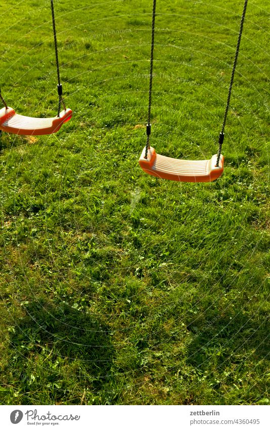 Children's playground with swing Playground children's playground Grass Lawn Meadow Swing Seat swing seat seat shell chain swing Light Shadow Summer Sun