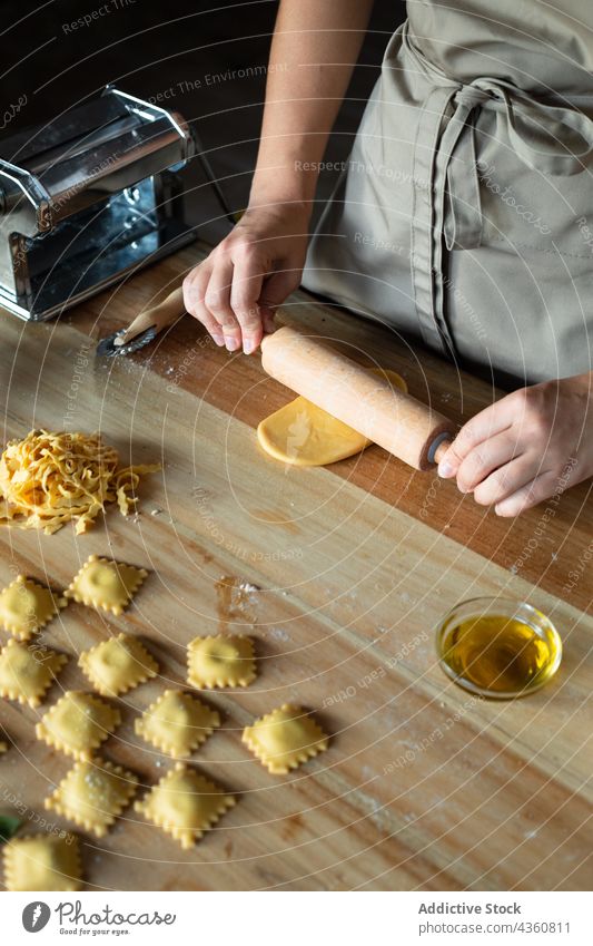 Anonymous Person Preparing Homemade Raviolis food cooking table preparation chef flour homemade wooden dough board closeup cooked cuisine culinary culture dish