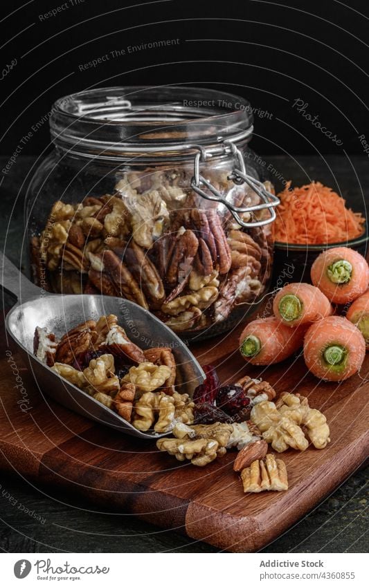 Glass jar with nuts and dried fruits food seed almond snack cranberry granola raisin homemade vegetarian glass healthy dessert diet organic sweet grain