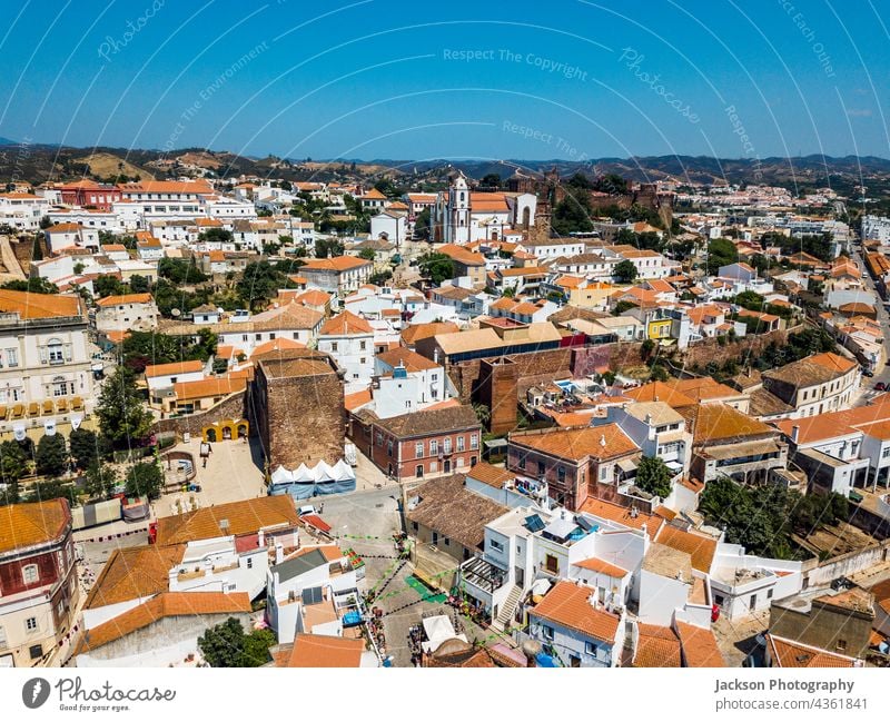 Aerial view of Silves with Moorish castle and historic cathedral, Portugal silves portugal algarve aerial architecture orange white washed top cityscape town