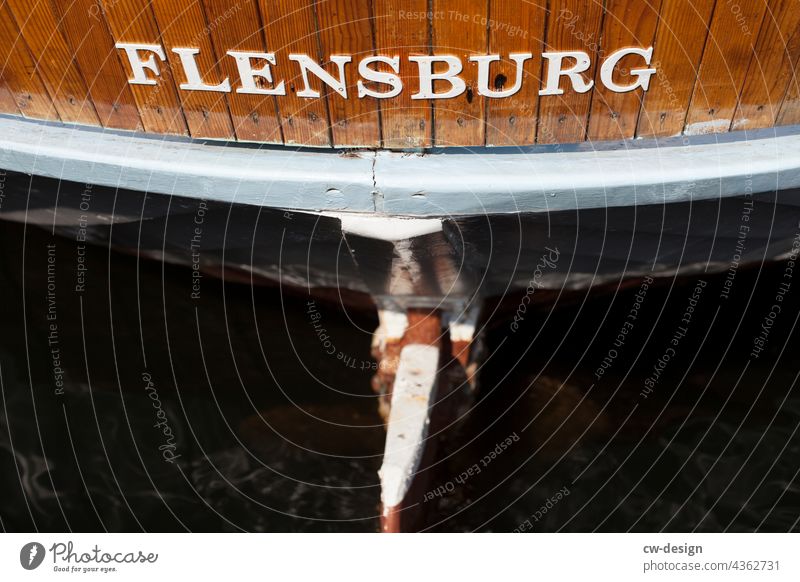 FLENSBURG Flensburg boat ship Navigation stern Hull Water Watercraft Surface of water Water reflection Summer Boating trip go boating Tourism Exterior shot