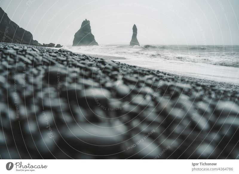 Stones on a black beach on an atmospheric day in Iceland Beach Black travel Rock Ocean Nature coast Water Landscape Sand Volcanic bank Outdoors Icelandic