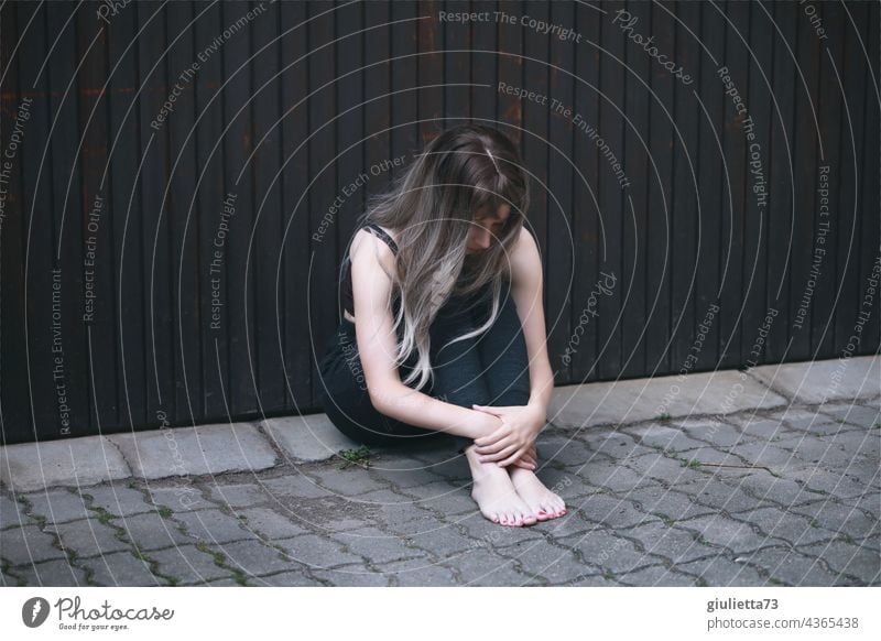 Portrait of a teenage girl, sitting outside on the ground, alone, sad, hopeless portrait Girl Woman Puberty Young woman 1 Youth (Young adults) Human being