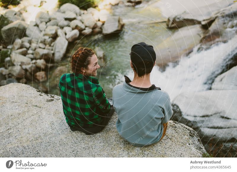 man and woman overlooking waterfall adults america california couple cuddle culture destination exploration explore exploring forest fresh giant hiker hiking