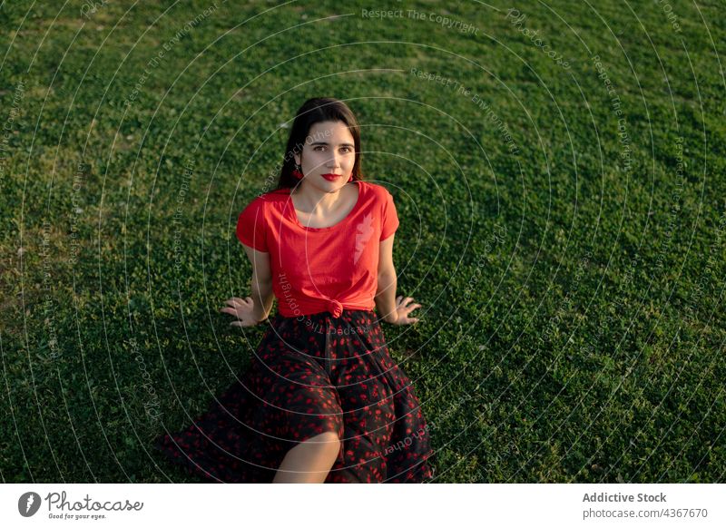 Serene woman chilling on lawn in park summer serene harmony sunset peaceful meadow enjoy female grass nature field sit calm tranquil carefree freedom