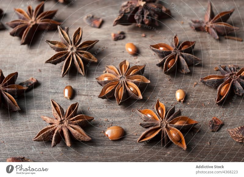 Anise stars on wooden table anise aroma spice seed background natural food rustic healthy aromatic dried organic ingredient cuisine product culinary gastronomy