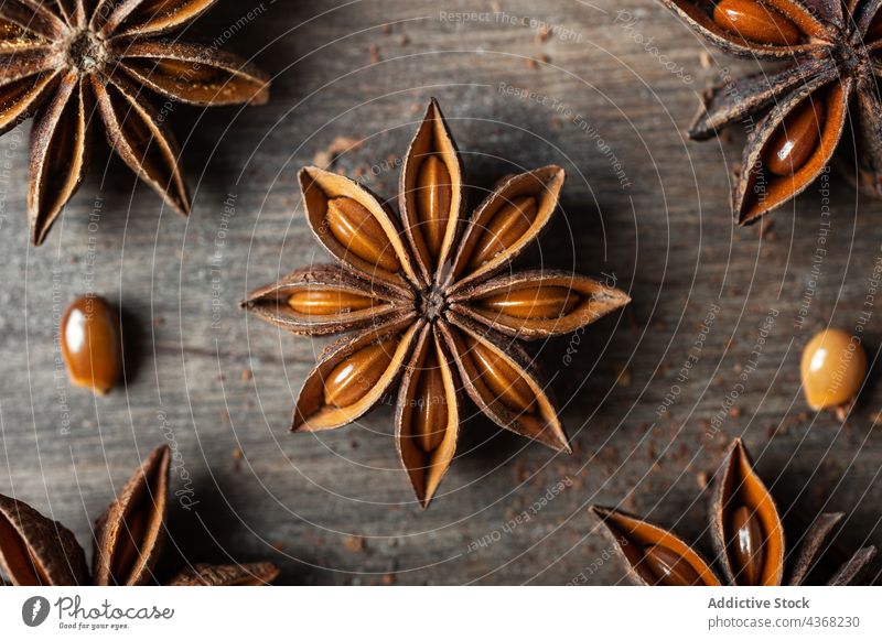 Anise stars on wooden table anise aroma spice seed background natural food rustic healthy aromatic dried organic ingredient cuisine product culinary gastronomy