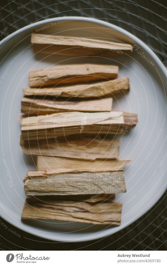palo santo sticks for energetic cleansing balance calm exercise health healthy lifestyle indoor meditation peace people physiotherapy practicing practitioner