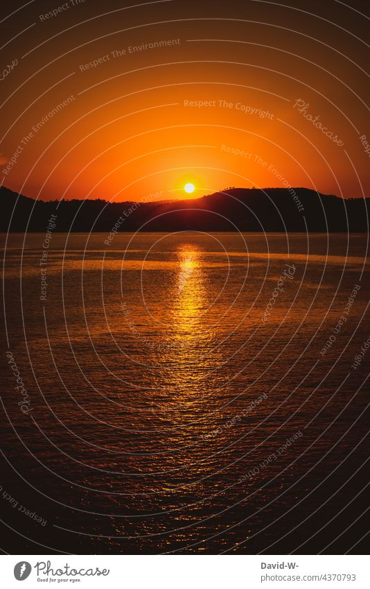 Sunset by the sea Ocean ocean Orange Illuminate Light Reflection Sunbeam Summer vacation Island stunning
