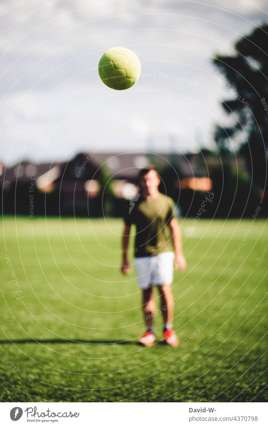flying football and footballer Foot ball Soccer player Leisure and hobbies Movement Flying Sports Sportsperson Athletic out Football pitch workout Success