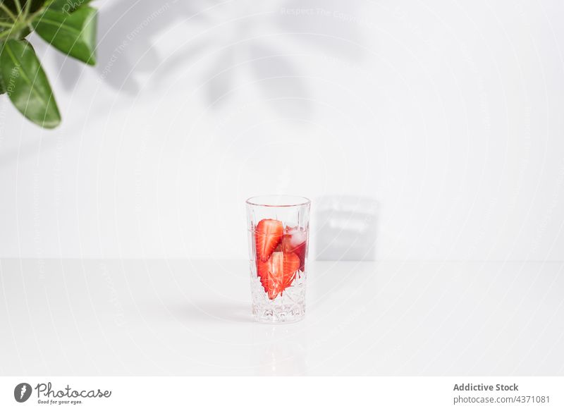 Detox drink with fresh strawberry infuse water detox cold glass summer beverage natural refreshment delicious tasty minimal simple vitamin healthy liquid serve