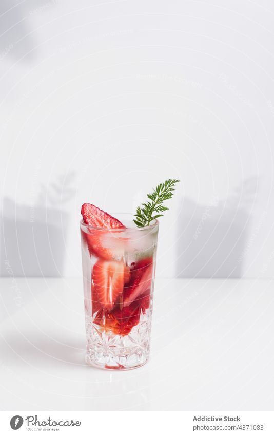 Detox drink with fresh strawberry infuse water detox cold glass summer beverage natural refreshment delicious tasty minimal simple vitamin healthy liquid serve