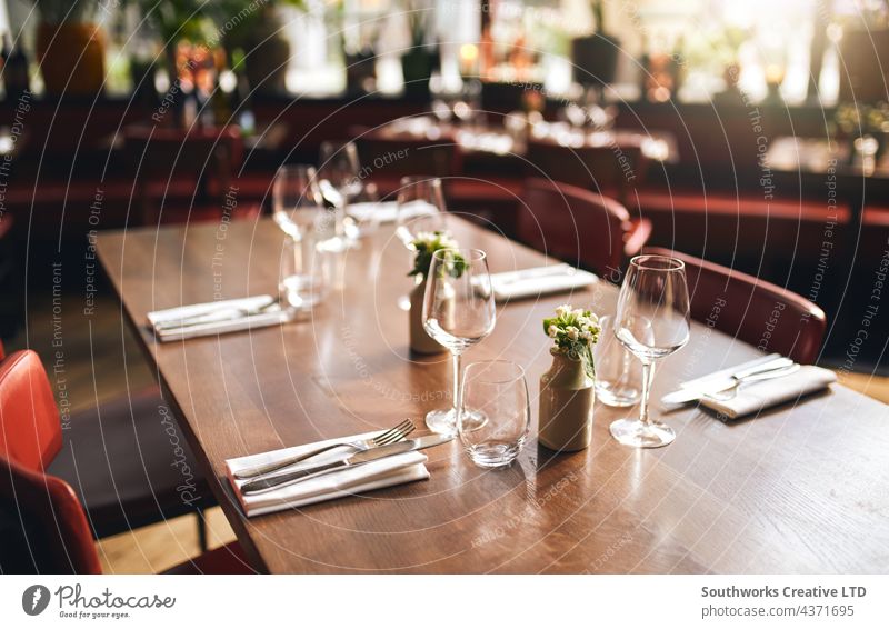 Glasses and cutlery on table in restaurant glass dinner empty hospitality food drink nobody indoors day venue dine eat preparation order organisation furniture