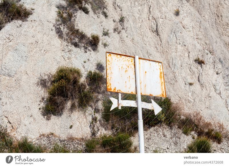 rusted sign outdoors with and arrow pointing right park empty no text rusty dirt white direction symbol pointer cursor next design down up orientation interface