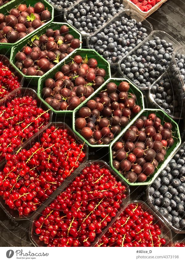 Berries Fruits mixture of currants, blueberries and red gooseberries in market bowls ripe vegetables and fruits healthy lifestyle raw food closeup supper basket