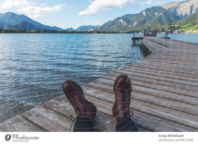 Let your soul dangle - Steg am Wolfgangsee in Austria Lake Wolfgang Footwear Legs Footbridge Landscape relax time-out Nature Water Europe Day Exterior shot