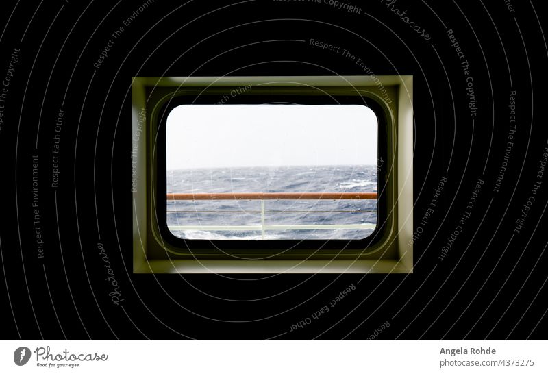 View from a cabin window of a cruise ship on the stormy sea atlantic ocean ocean waves ocean horizon splashing wild dramatic sky travel foam rolling heavy water