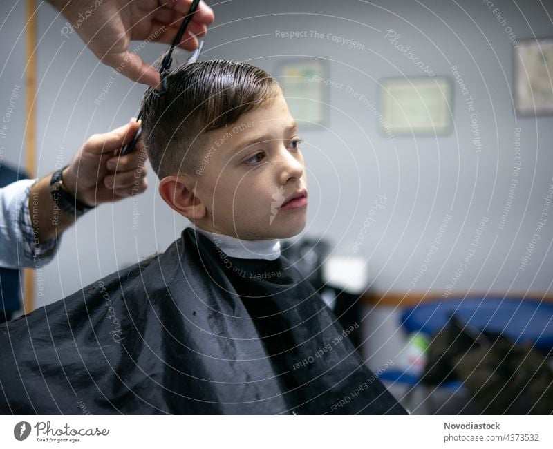 young boy having a hair cut head beauty haircut coiffure childhood caucasian barber black model children man razor splatter professional client barbershop male