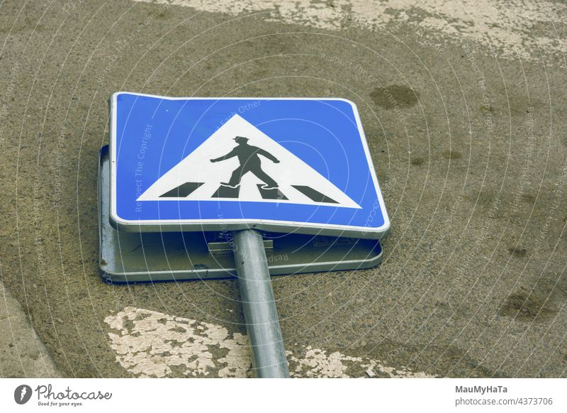 road sign demolished on the road Road sign Road traffic Signs and labeling Street Colour photo Exterior shot Traffic infrastructure Transport Town Day Safety