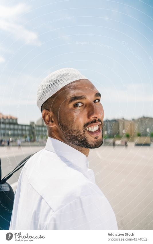 Muslim man in traditional clothes islam muslim ethnic arab portrait culture religion garment appearance exterior male building shabby apparel cap hat headwear