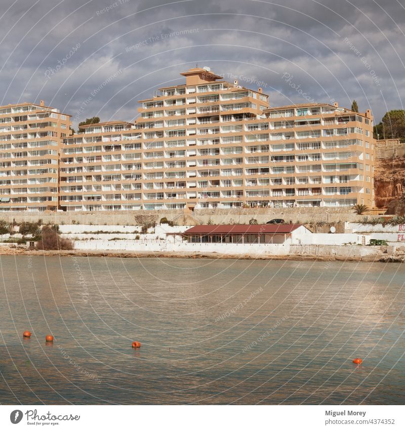 Apartment building on the coast, use as an example of destruction of the Mediterranean coast Apartment house House (Residential Structure) Apartment Building