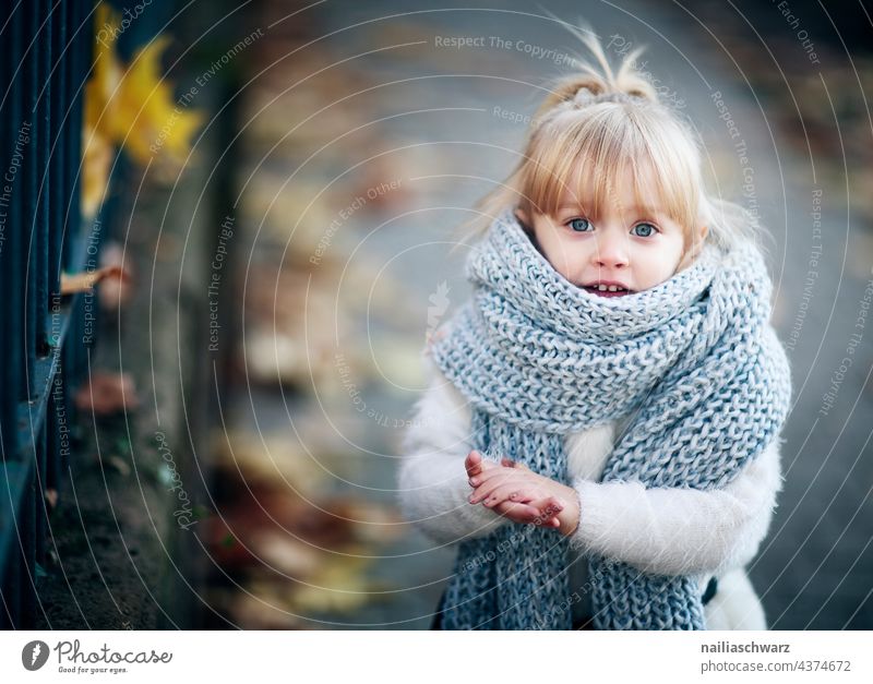 autumn. Autumn Autumnal Cold Scarf Child Infancy dreamily Park portrait Gorgeous Girl`s face Cute Outdoor photography kind Friendliness people outdoor smilingly