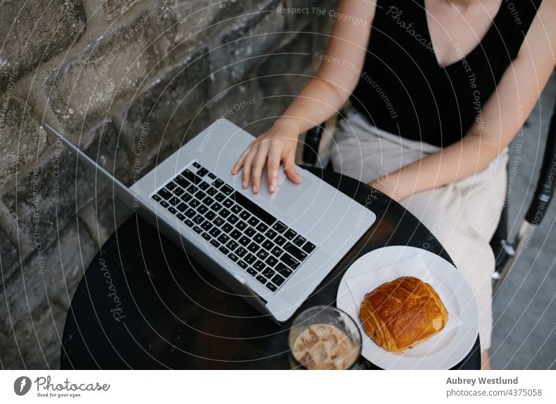 Young professional woman working remotely from an outdoor coffee shop 25-30 30-35 years adult american blogger blonde boss cafe caucasian commute computer
