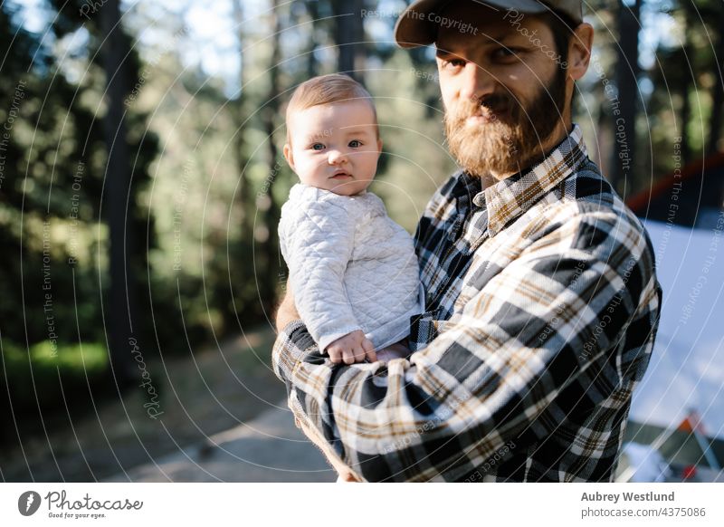 father and baby daughter camping in the woods 25-30 30-35 30-40 beard bonding california camper campsite caucasian chair child childhood dad daddy family fire