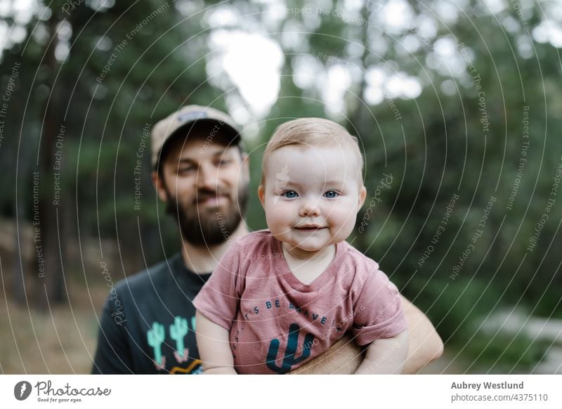father carrying his baby daughter on a walk through the woods 25-30 30-35 30-40 6 months beard bonding california camp camper camping campsite caucasian chair