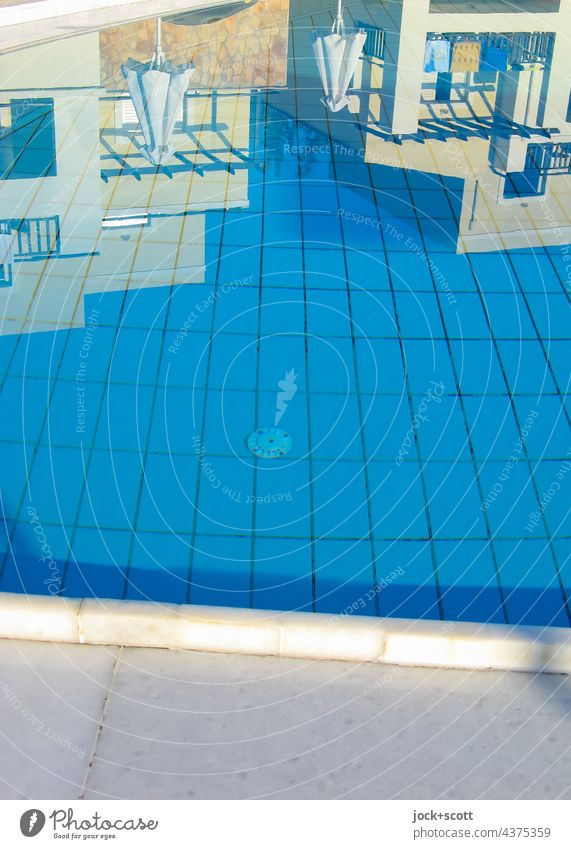 still water early in the morning at the pool swimming pools Water Calm Vacation & Travel Hotel facilities Summer Swimming pool Reflection Blue Ground Tile