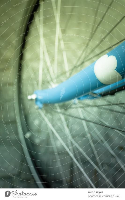 Bicycle wheel with a cloud bicycle wheel bicycle wheel spokes Clouds sky blue blue bike Spokes Cycling Wheel rim Exterior shot Means of transport Close-up Metal