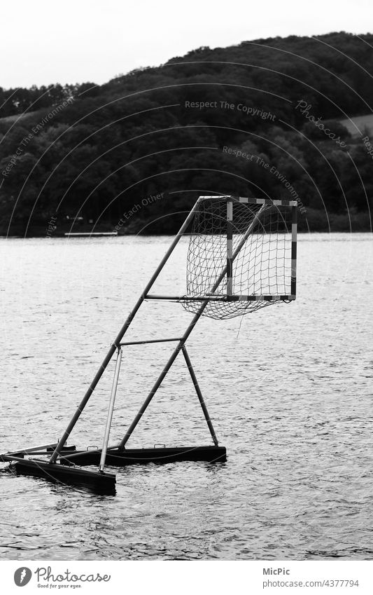Goal canoe polo Water Aquatics Rainy weather Black & white photo kanupolotor penalty Surface of water Leisure and hobbies Summer Exterior shot Sports Waves Day