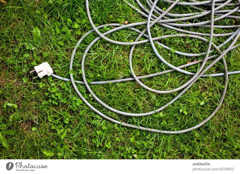 Extension cable Garden Cable cable reel allotment Garden allotments Deserted Nature tranquillity Holiday season Garden plot stream power cable Copy Space