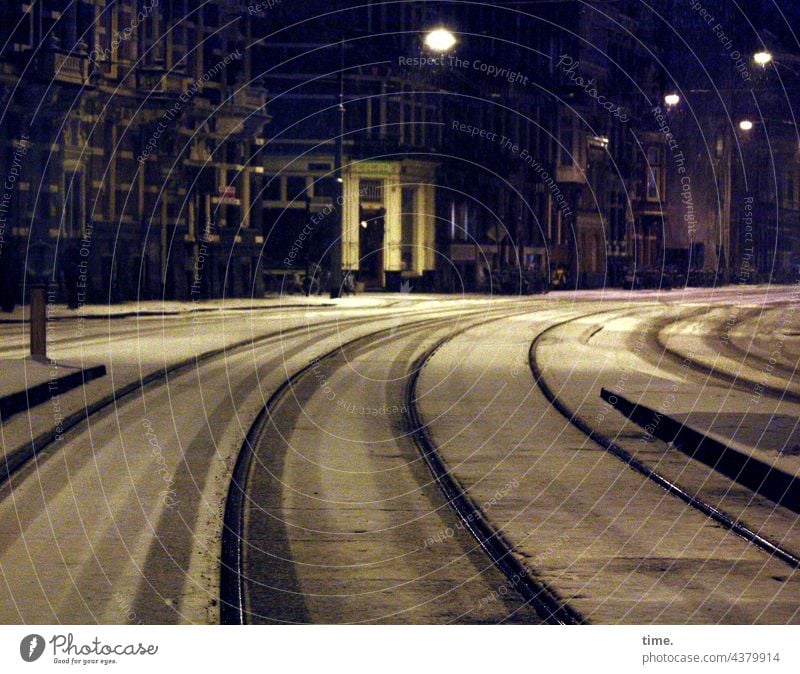 curve position tram tracks at night Snow houses urban Artificial light streetlamp street lamps Facades Rail transport Curve