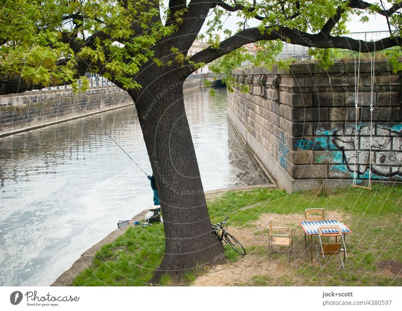 idyllic fishing spot at the canal in the middle of Berlin Spree Canal Green space Downtown Downtown Berlin Channel Branch Swing Table chairs Oasis