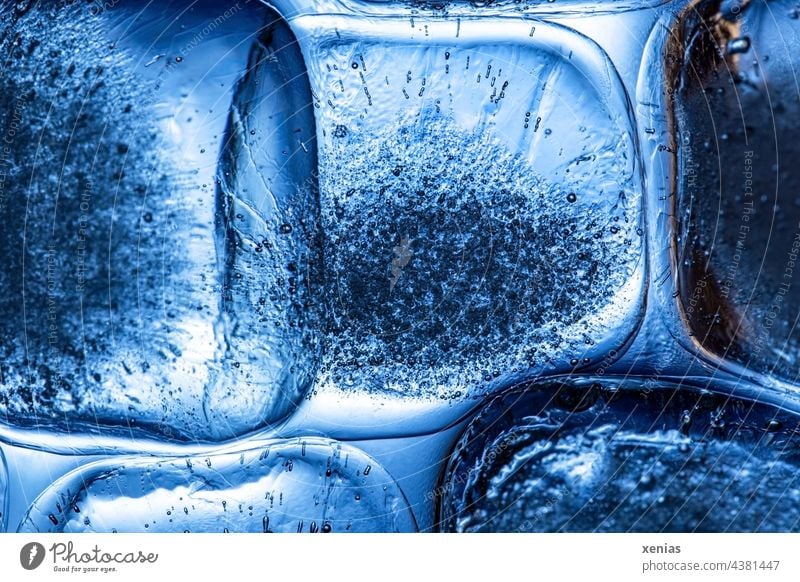 https://www.photocase.com/photos/4381447-macro-image-ice-cube-illuminated-with-blue-light-photocase-stock-photo-large.jpeg