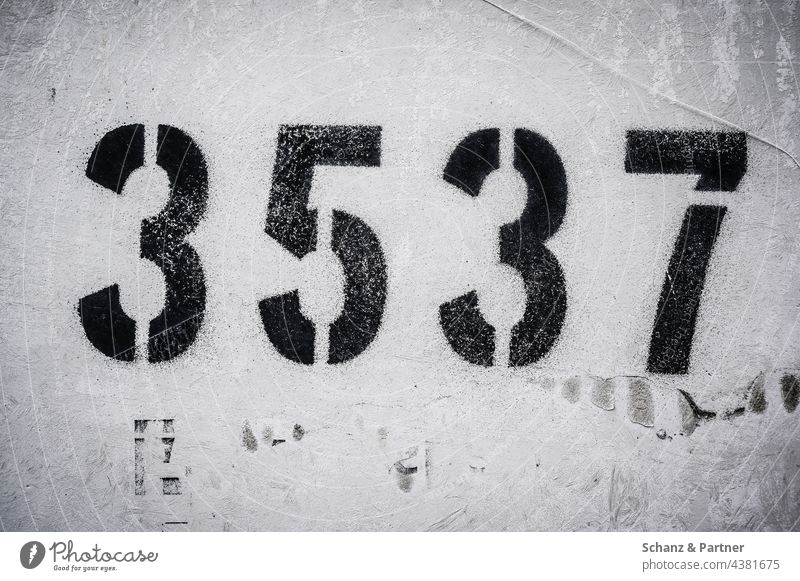 four-digit number on a wall figures Wall (building) payment code numerically numbering 3 5 7 Code Digits and numbers Signs and labeling Characters House number