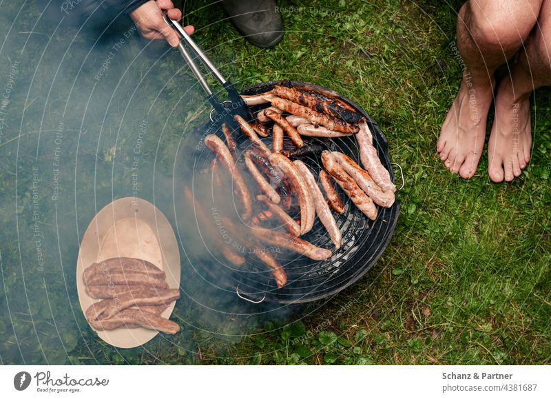 Grill full of sausages in the garden BBQ Barbecue (apparatus) Sausages Small sausage Meat Garden Nutrition Camping Camping site Smoke Exterior shot Bratwurst
