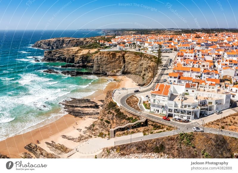 Aerial view of Zambujeira do Mar - charming town on cliffs by the Atlantic Ocean in Portugal portugal zambujeira do mar alentejo coast atlantic drone aerial