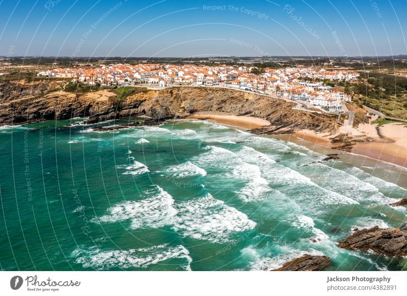 Aerial view of Zambujeira do Mar - charming town on cliffs by the Atlantic Ocean in Portugal portugal zambujeira do mar alentejo coast atlantic drone aerial