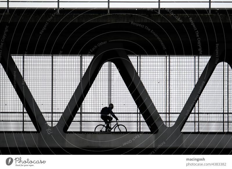 Cyclist silhouette on box bridge Bridge Box bridge Railway bridge cyclists Silhouette Black & white photo Black and white photography black-and-white Dark